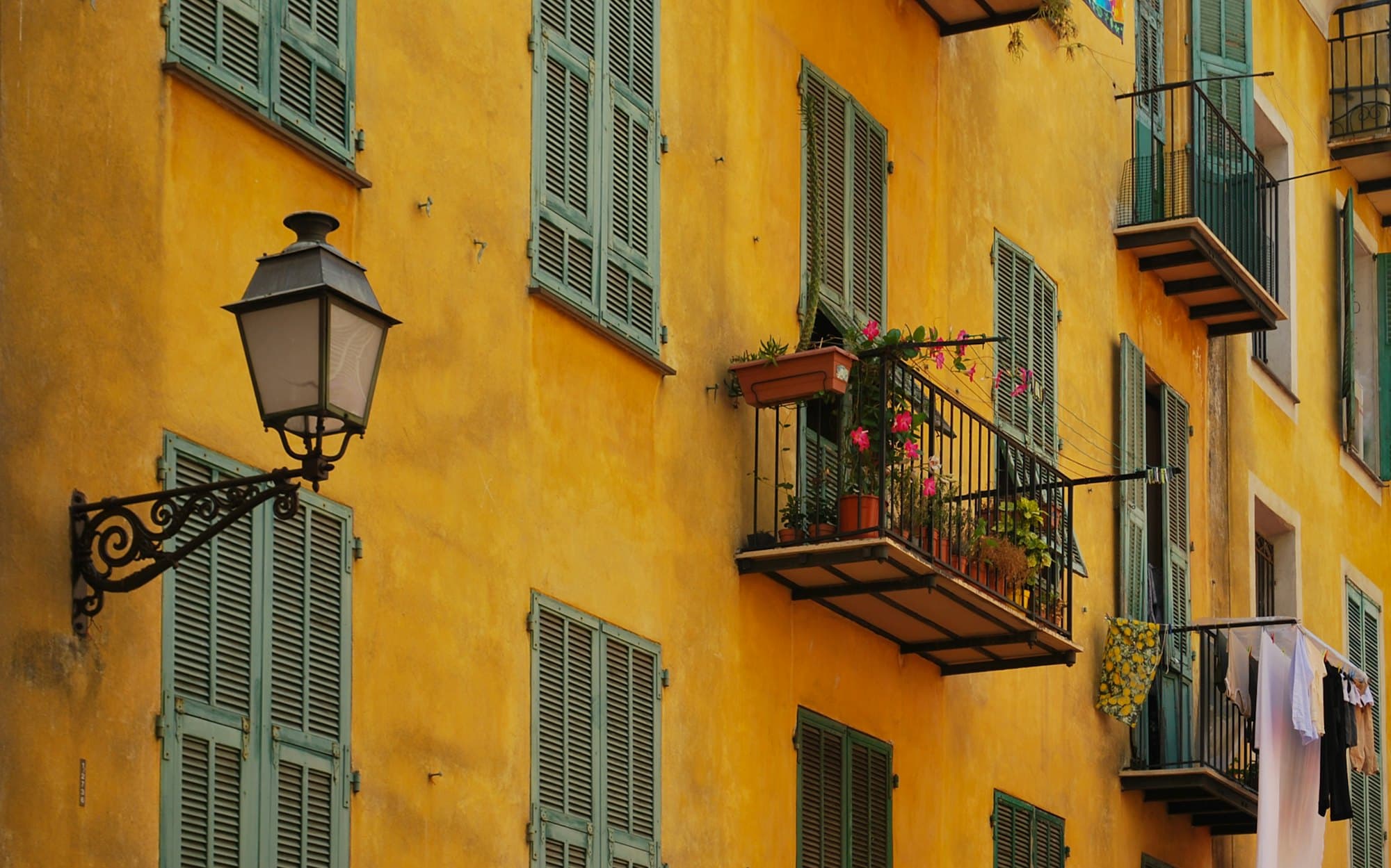 Sunlit Provençal facade with a lantern