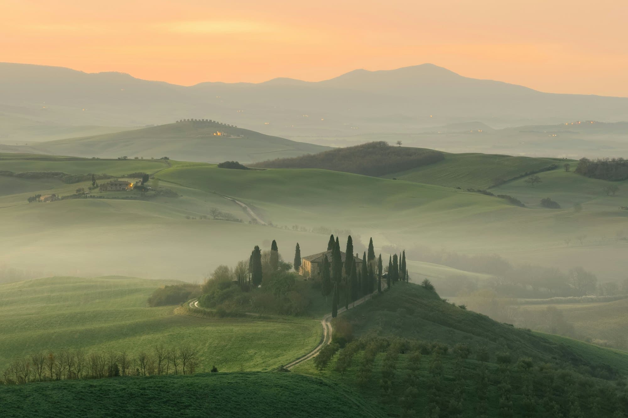 Tuscan farmhouse in golden evening light